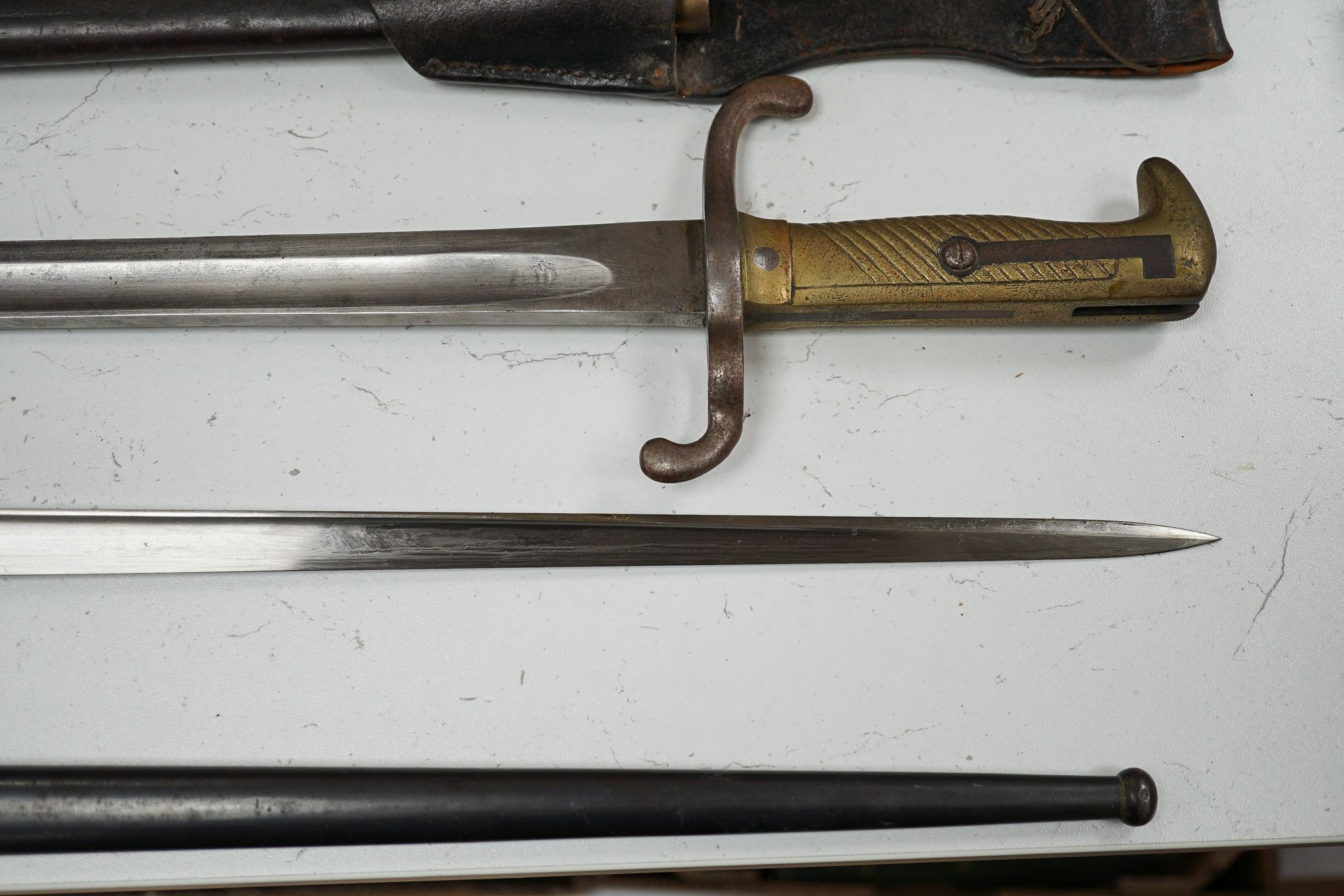 A French bayonet and scabbard with matching serial number (38804) and inscription and date to back of blade (1879) and another Solingen bayonet and scabbard